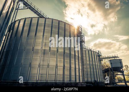 A low-angle shot of a modern grain storage silo Stock Photo