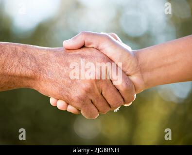 Were invincible when were together. Shot of two unrecognisable men shaking hands outdoors. Stock Photo