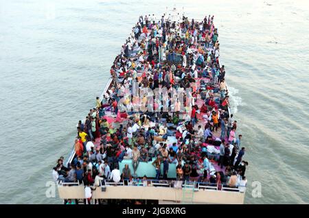 Dhaka, Bangladesh. 8th July 2022. Ferries packed with travelers are seen at Sadarghat Terminal. As Eid-ul-Adha Festival is drawing near, thousands of Bangladeshi capital dwellers have streamed out of the city to join the festival with their kith and kin in village homes. Bangladesh Muslims will celebrate Eid-ul-Adha. Photo by Habibur Rahman/ABACAPRESS.COM Credit: Abaca Press/Alamy Live News Stock Photo