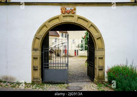 Germany, Baden-Württemberg, Black Forest, marriage coat of arms of Count Rudolf IV of Sulz (center) and Baroness Barbara of Staufen (left) and Agatha of Limpurg (right), above archway at entrance to Tiengen Castle. Stock Photo