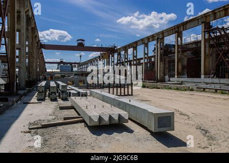 Territory of reinforced concrete factory Stock Photo - Alamy