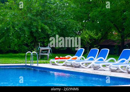 The concept idea of having a pleasant holiday thanks to the garden with the pool and the garden with the pool in the detached house Stock Photo