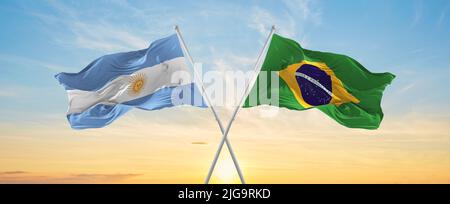 crossed national flags of Argentine and Brazil flag waving in wind at ...