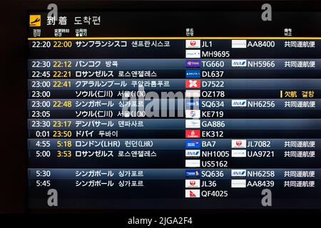 Arrivals flight board at Haneda Airport, Tokyo, Japan Stock Photo