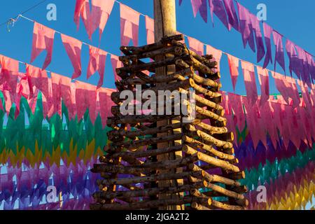 festa junina decoration - decorative bonfire and colorful flags Stock Photo