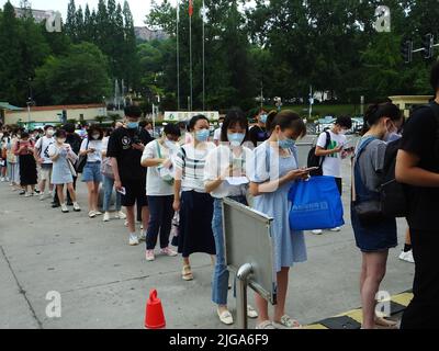 YICHANG, CHINA - JULY 9, 2022 - Candidates queue up to take the 2022 Civil service exam in Yichang, Central China's Hubei province, July 9, 2022. Stock Photo