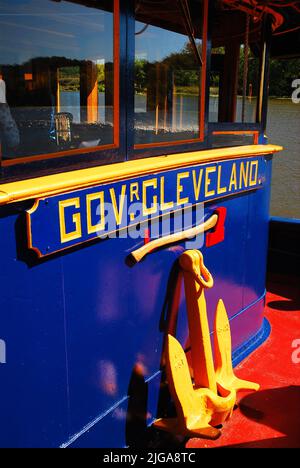 The blue and yellow Governor (Gov) Cleveland a historic tugboat is on display at a maritime museum in Kingston, New York