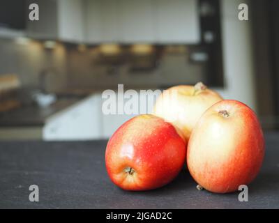 Ripe red apples on the table close-up. Stock Photo