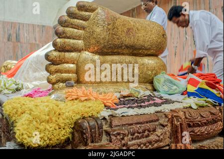 08 28 2008 Golden Buddha's foot at the temple Mahaparinirvana Kusinara or Kushinagar, Uttar Pradesh, India Stock Photo