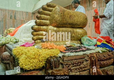 08 28 2008 Golden Buddha's foot at the temple Mahaparinirvana Kusinara or Kushinagar, Uttar Pradesh, India Stock Photo