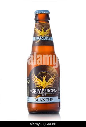 LONDON,UK - JUNE 03, 2022:Grimbergen wheat blanche beer in glass bottle on white. Stock Photo