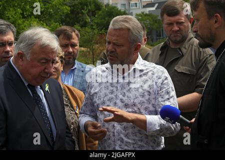 BUCHA, UKRAINE - JULY 8, 2022 - President of the Senate of the French Republic Gerard Larcher (L), who heads the delegation of the upper house of the French Parliament, and Bucha city head Anatolii Fedoruk visit the mass burial sites of civilians killed by Russian invaders located near the Church of Saint Andrew the First-Called Apostle and All Saints, Bucha, Kyiv Region, northern Ukraine. Photo by Pavlo Bagmut/Ukrinform/ABACAPRESS.COM Stock Photo