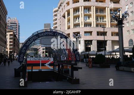 A Yerevan center Northern Avenue street surrounded by buildings Stock Photo