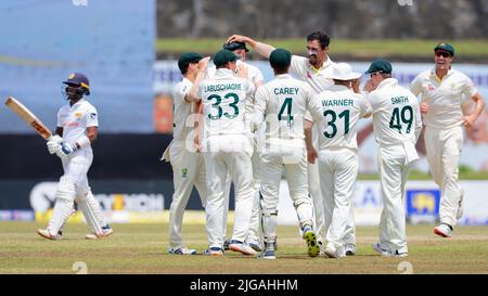 Galle, Sri Lanka. 9th July 2022. Mitchell Starc of Australia celebrates with teammates after taking the wicket of Pathum Nissanka of Sri Lanka during the 2nd day of the 2nd test cricket match between Sri Lanka vs Australia at the Galle International Cricket Stadium in Galle on 9th July, 2022. Viraj Kothalwala/Alamy Live News Stock Photo