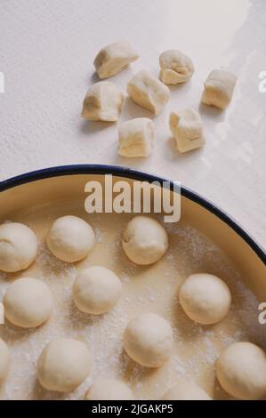 Close up of female hands preparation of dough for Baklava, homemade Baklava with walnuts, old style traditional Turkish recipe, Food pastry Stock Photo