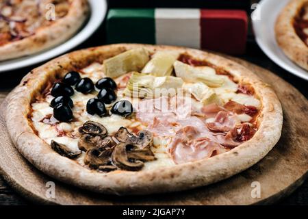 A Quattro stagioni Italian pizza.Four season pizza close up Stock Photo