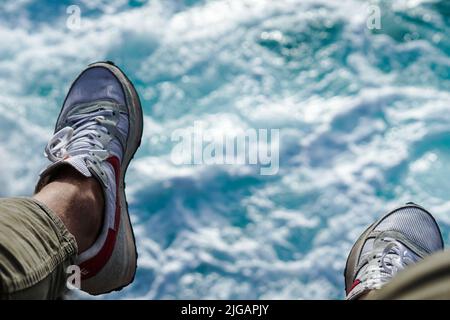 The Shoes with a blurry blue water background Stock Photo