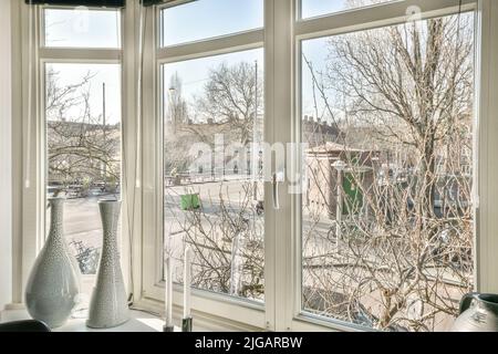 Beautiful view from the large white plastic panoramic window to the street Stock Photo