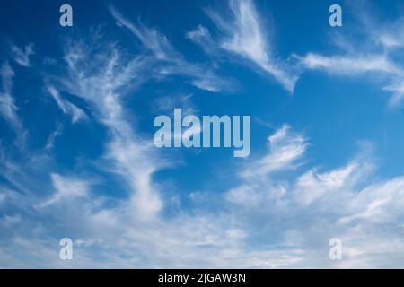 Summer blue sky, cirrus clouds, gradient light white background. Sunny air background. Blue landscape in the environment. Stock Photo