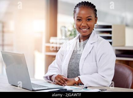 Thank your doctors for their work. a female doctor working on her laptop. Stock Photo