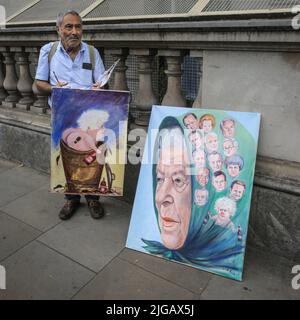 Satirical artist and painter Kaya Mar with his latest works outside Downing Street on the day of Boris Johnson's resignation, London Stock Photo