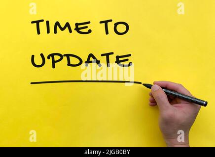 Time To Update text on yellow cover background. Update concept Stock Photo