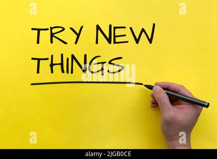 Try new things text on yellow background cover. Try new things concept Stock Photo