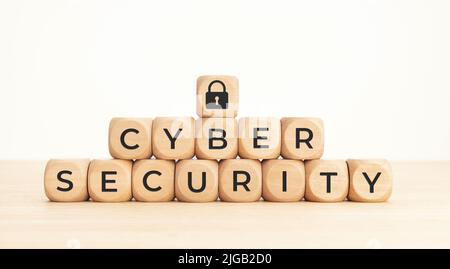 Cybersecurity data protection concept. Text and lock pad icon on wooden blocks Stock Photo