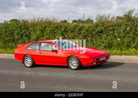 1987 80s eighties red British M50 Lotus Eclat Excel 2174cc 5 speed manual coupe 2+2 super-sports car ; en-route to Hoghton Tower for the Supercar Summer Showtime car meet which is organised by Great British Motor Shows in Preston, UK Stock Photo