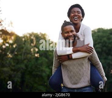 We have so much fun together. a young couple spending a day at the park. Stock Photo