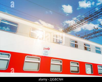 Moscow, Russia. April 22, 2022. Russian Railways double-decker car. RZD logo. The windows of the new passenger train.  Stock Photo