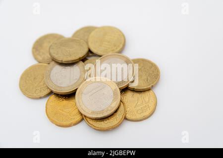 Euro coins lying on a white background Stock Photo