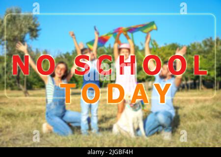 Text NO SCHOOL TODAY and happy family resting in park Stock Photo