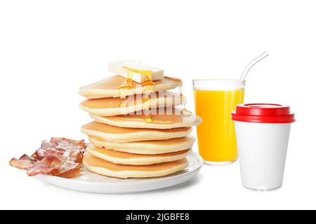 Fast breakfast with sweet pancakes and bacon, cup of hot coffee and glass of orange juice on white background Stock Photo