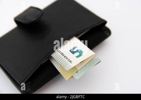 Closeup of euro banknotes sticking out of a wallet Stock Photo