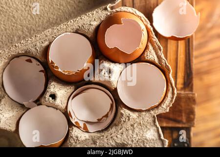 Cardboard holder with broken egg shells, closeup Stock Photo