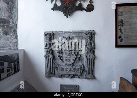 Carved structure with photographs and frames at old pharmacy museum in historic town Stock Photo