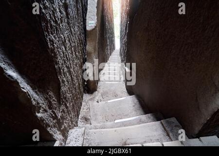 Steep narrow stairway between two gigantic rocks in rock garden Adersbach, Czech Republic. Stock Photo