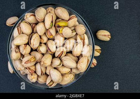 Pistachios in a glass bowl. Stock Photo