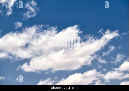 Beautiful white clouds on a deep blue sky on a summer day Stock Photo