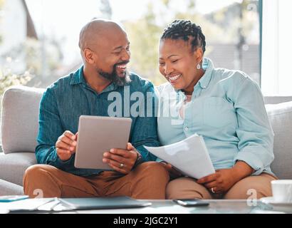 Were in this together. a mature couple using a digital tablet together. Stock Photo