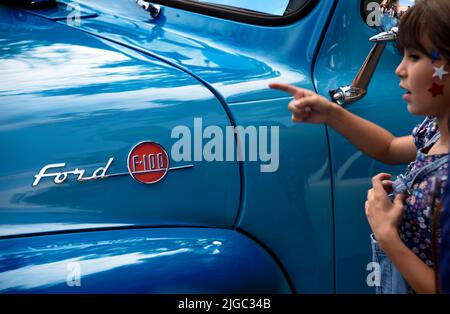 A vintage 1955 Ford F-100 pickup truck on display at a Fourth of July car show in Santa Fe, New Mexico. Stock Photo