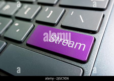 Close up view on conceptual keyboard - Stream key. color button on gray keyboard Stock Photo