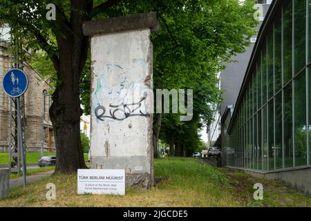 Tallinn, Estonia. July 2022.  a piece of the Berlin Wall in front of the Vabamu Museum of Occupations and Freedom in the city center Stock Photo