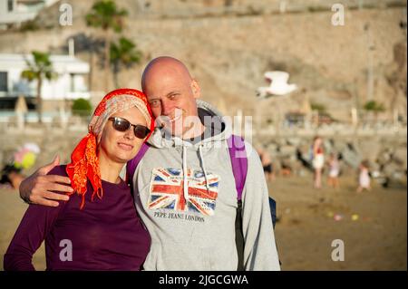 February 4 2022-Mature couple poses on the beach in Puerto Rico Canary Island Stock Photo