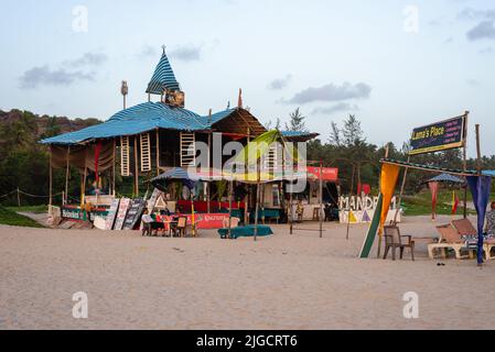 Mandrem Beach, Goa India March 2 2022: Tourists and families relaxing and enjoying at Mandrem Beach in Goa India Stock Photo