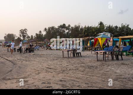 Mandrem Beach, Goa India March 2 2022: Tourists and families relaxing and enjoying at Mandrem Beach in Goa India Stock Photo