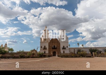 Beautiful vista of the San Xavier del Bac Mission in Tucson, Arizona, under dramatic monsoon sky Stock Photo