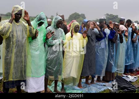 Lagos, Nigeria, 9th July, 2022  Muslim faithful, despite the heavy rainfall, pray to mark the 2022 Eid-el-Kabir festival at Ikeja Along in Lagos, Nigeria, on Saturday July 9, 2022. Photo by Adekunle Ajayi Credit: Adekunle Ajayi/Alamy Live News Stock Photo