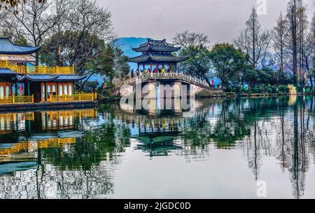 Old Chinese Bridge Quyuan Garden Yellow Boat West Lake Hangzhou Reflection Zhejiang Province China . Stock Photo